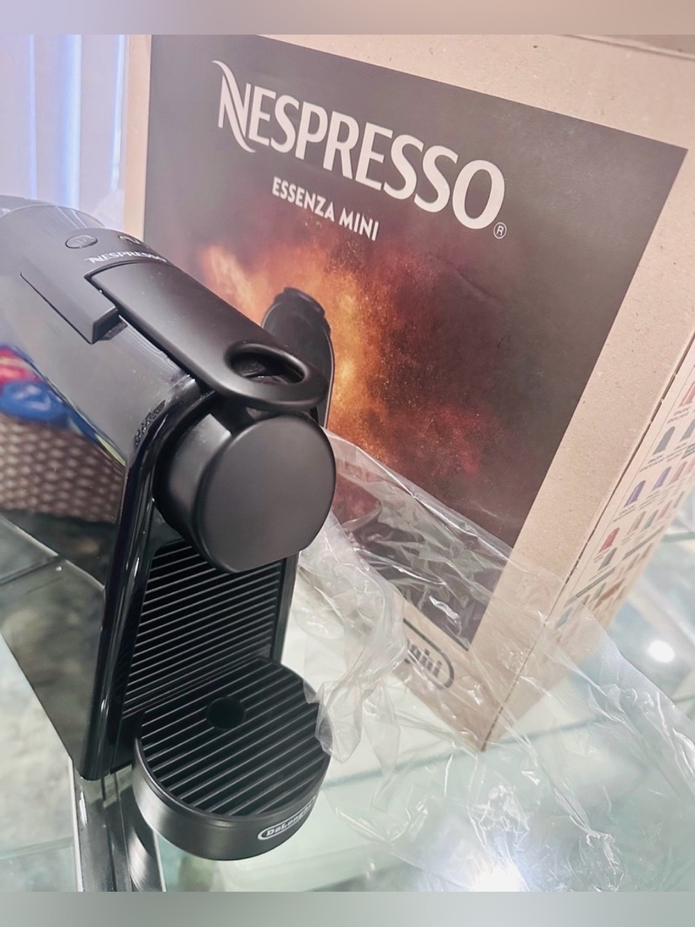 NESPRESSO ESSENZA MINI WITH GLASS CAPSULE HOLDER BASE.